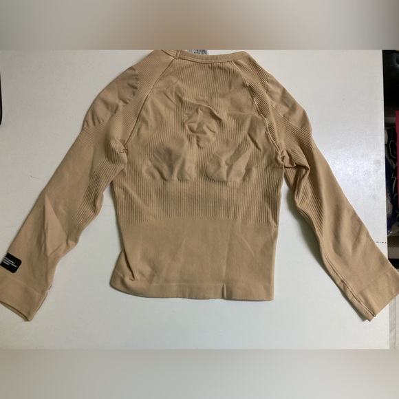 ADIDAS
Women Solid Round Neck Beige T-Shirt - Picture 9 of 9